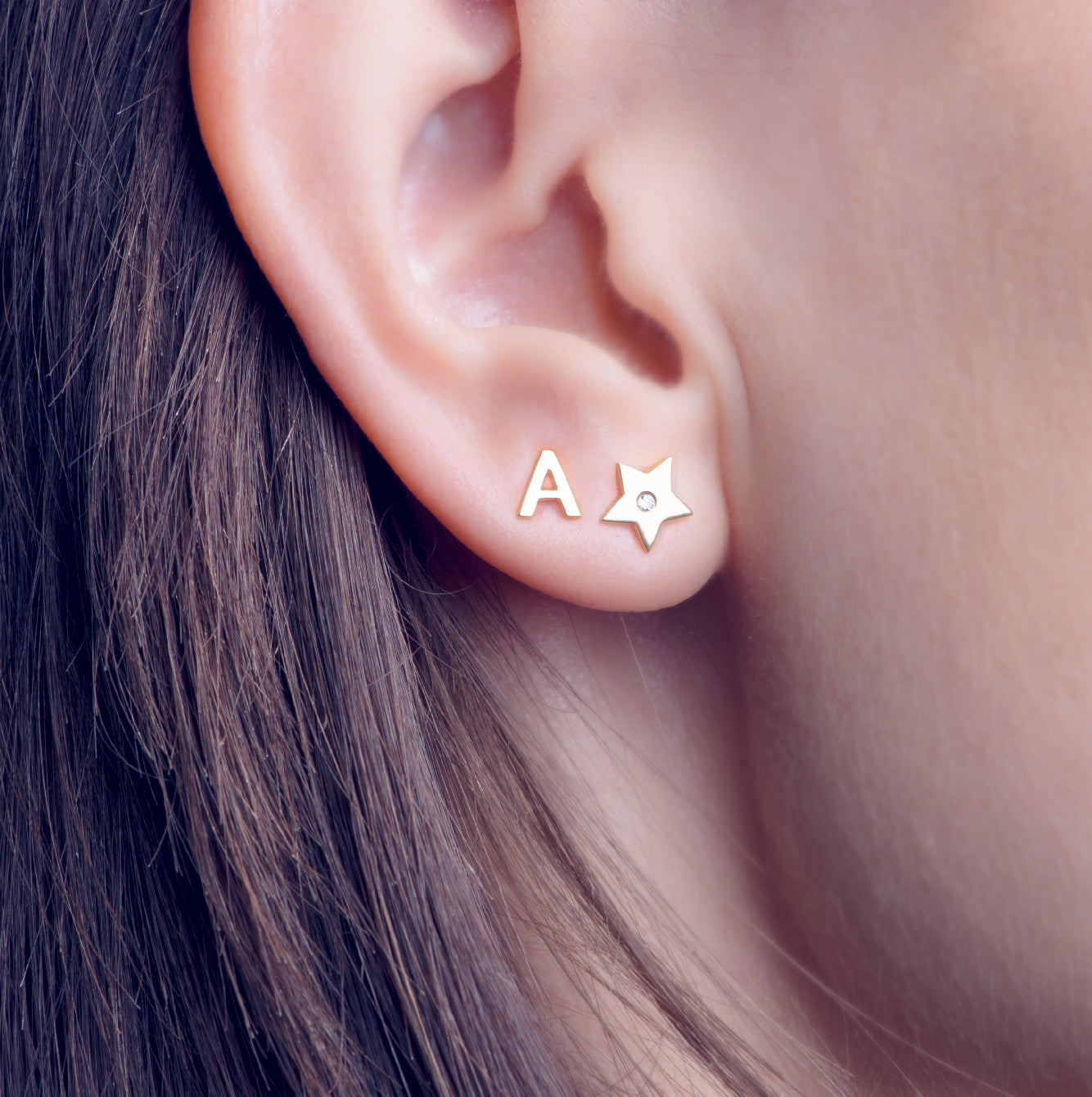 aretes de mujer de estrella con piedra circonia de plata